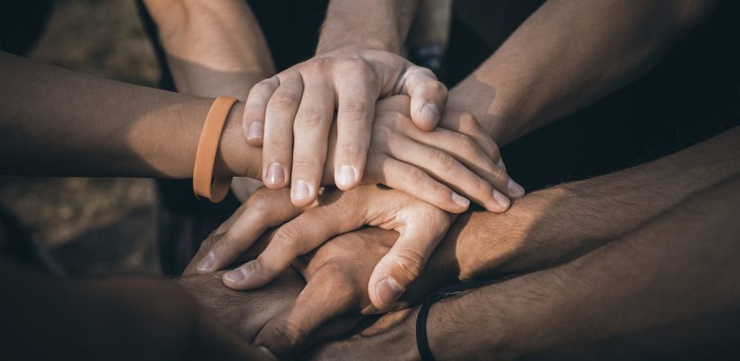 Teamwork Join Hands Support Together Concept. Sports People Joining Hands.